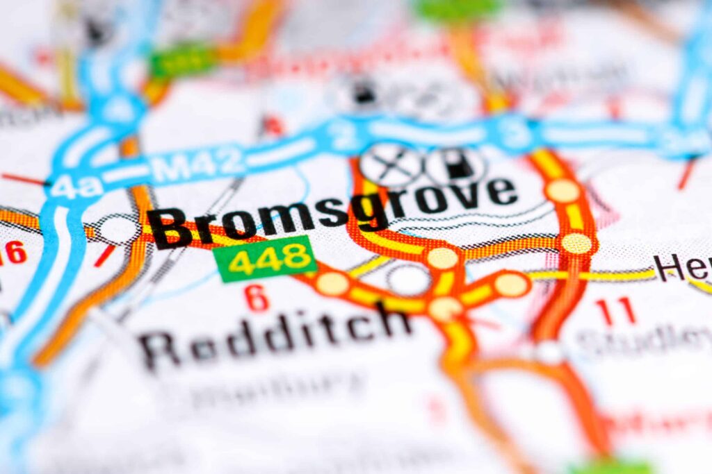 Close-up of a detailed map showing the roads and highways around Bromsgrove, highlighted in bold text. Nearby areas like Redditch are also visible, along with route numbers and road patterns. BDHT developments are prominently marked, offering insights into local infrastructure. ©Mobysoft