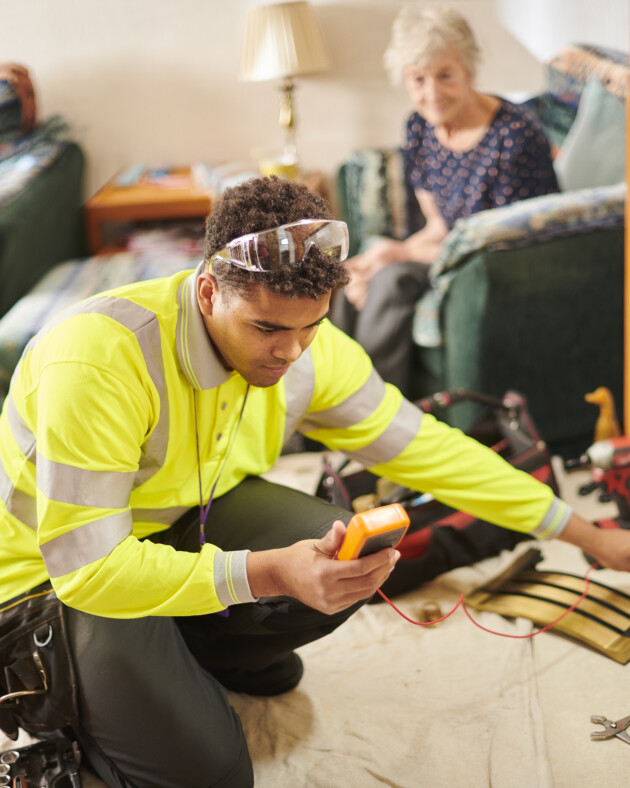 heating engineer repairing gas fire