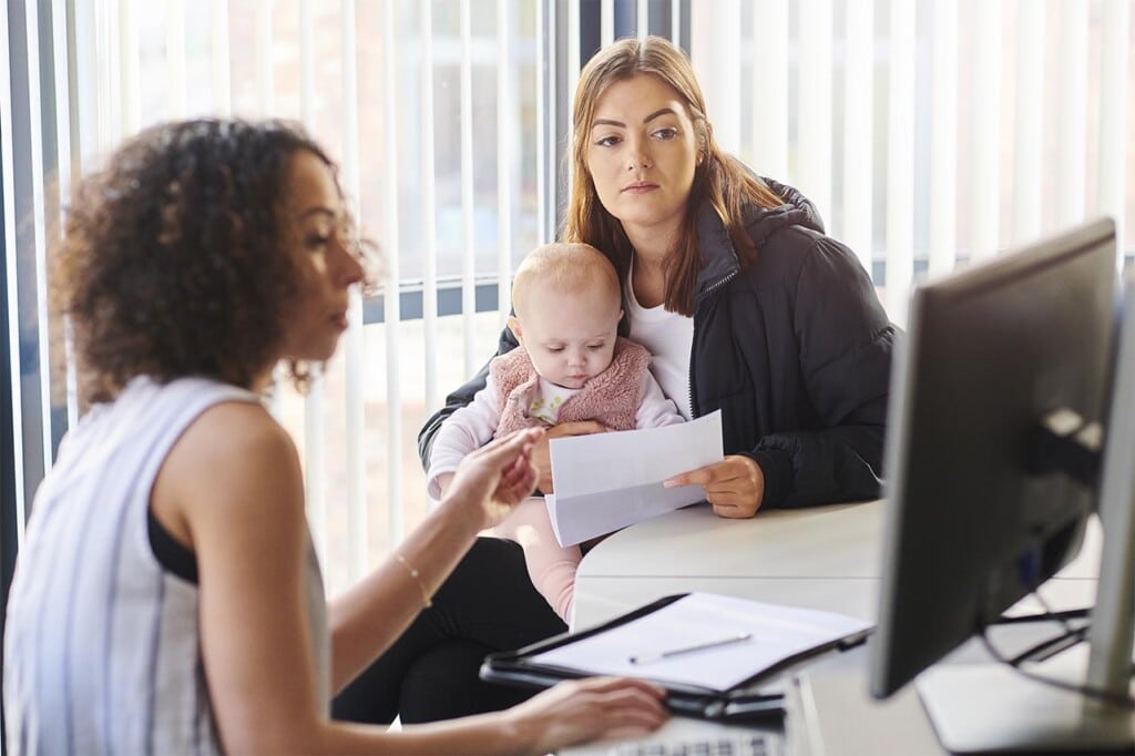 young mother with social services or housing officer